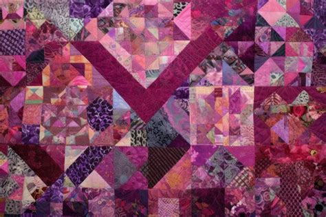 Premium Ai Image Vibrant Patchwork Quilt In Shades Of Pink And Purple