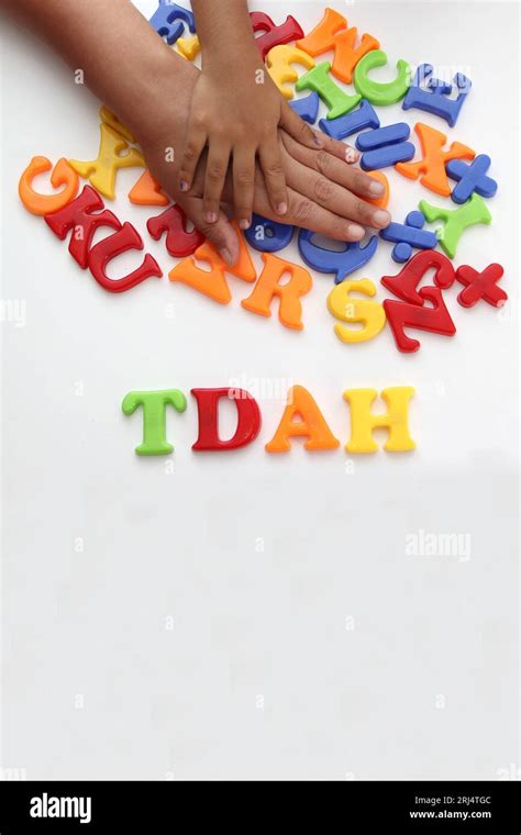 Hands Of Mom And Daughter Playing With Colored Letters That Form Adhd