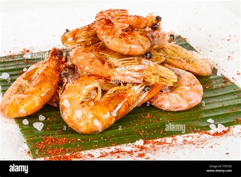 Fried Black Tiger Prawns With Herbs And Spices On Banana Leaf Stock