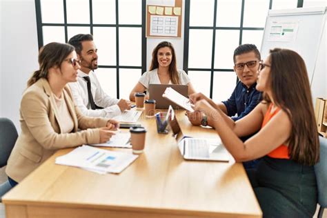 Group Of Hispanic Business Workers Smiling Happy Working At The Office