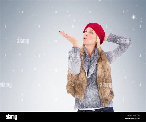 Blonde In Winter Clothes Blowing Kiss Stock Photo Alamy