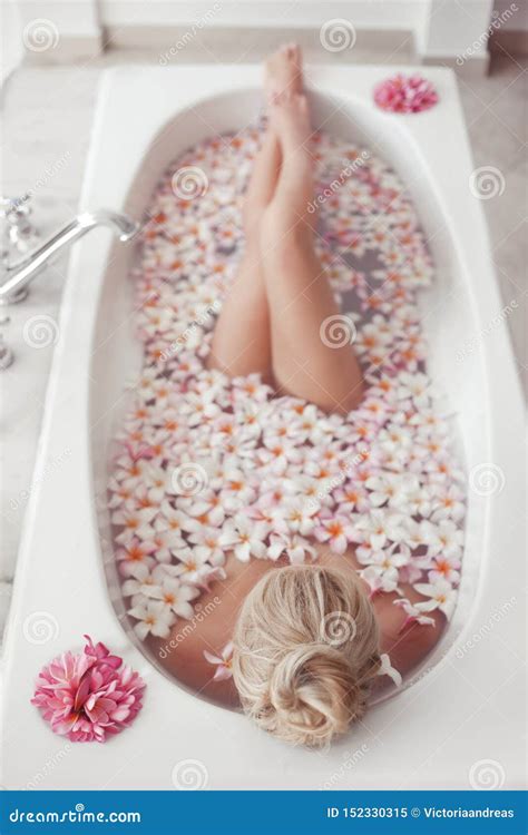 Spa Relax Blonde Enjoying Bath With Plumeria Tropical Flowers Health And Beauty Stock Image