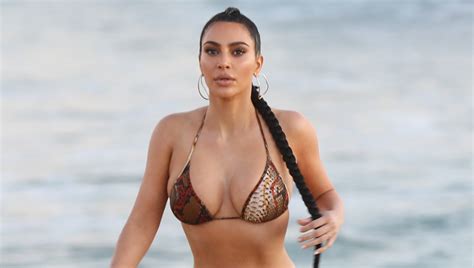 Kim Kardashian Flaunts Her Curves In A Bikini See The Beach Photos