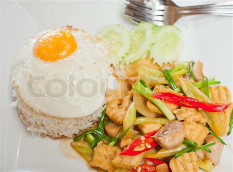 Sunny Side Up Egg On Rice With Spicy Fried Vegetable And Pork Slice