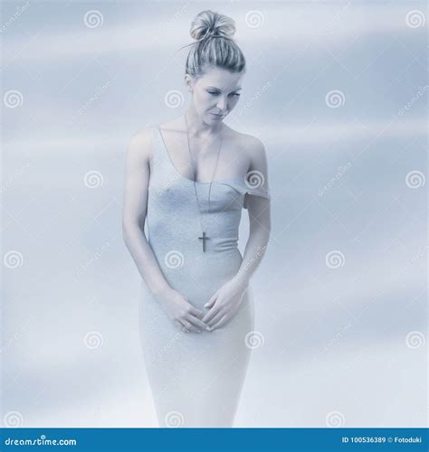 Blonde Slim Girl In Bikini Moves On Hands Knees Out Of Water Royalty Free Stock Photography