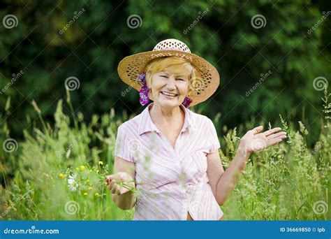 Joy Friendly Happy Mature Woman In Straw Hut With Stretched Arms Stock