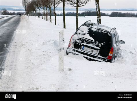 Car Stuck In A Snowdrift Winter Germany Europe Stock Photo Alamy