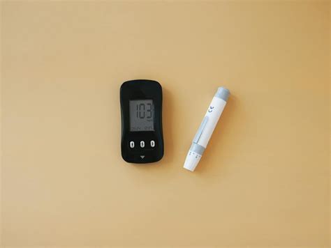 A blood glucose meter and a blood glucose meter · Free Stock Photo