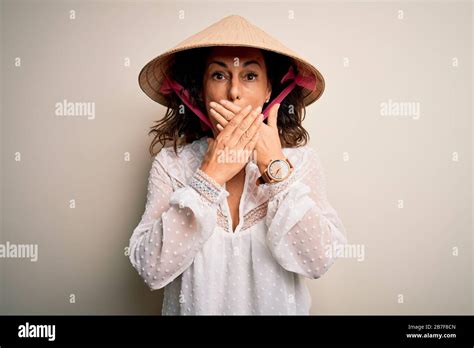 Middle Age Brunette Woman Wearing Asian Traditional Conical Hat Over