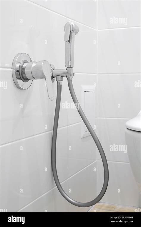 Chrome hygienic shower close-up Stock Photo - Alamy