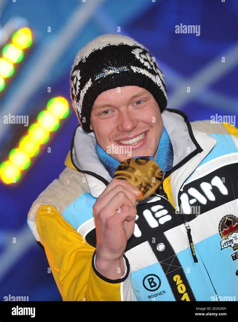 German Gold Medallist Felix Loch Stands On The Podium During The Medal