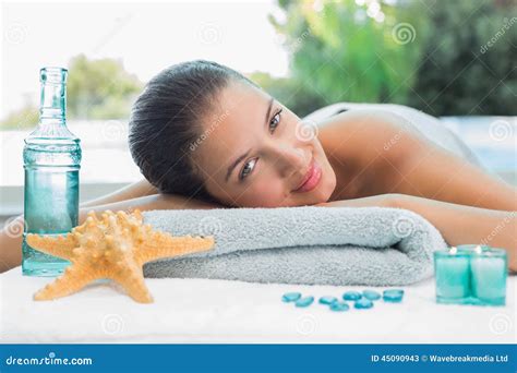 Beautiful Woman Lying On Massage Table At Spa Center Stock Image