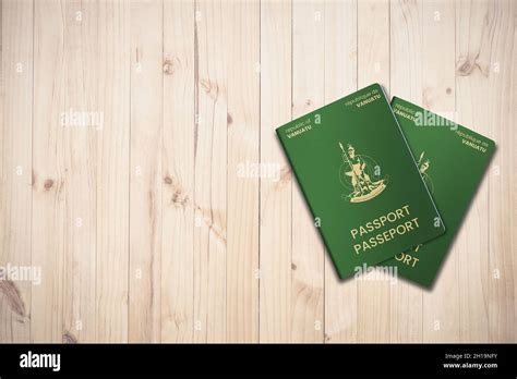 Two Vanuatu Passports On A Wooden Background Citizenship By Investment