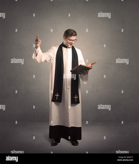 young priest in giving his blessing Stock Photo - Alamy