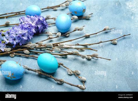 Pussy Willow Branches Painted Easter Eggs And Hyacinth Flowers On Blue Background Stock Photo