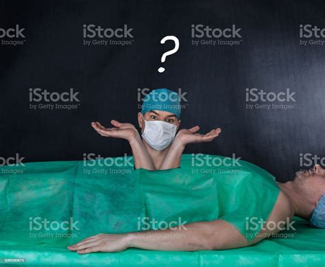 Funny Surgery Operation On A Black Background Stock Photo Download