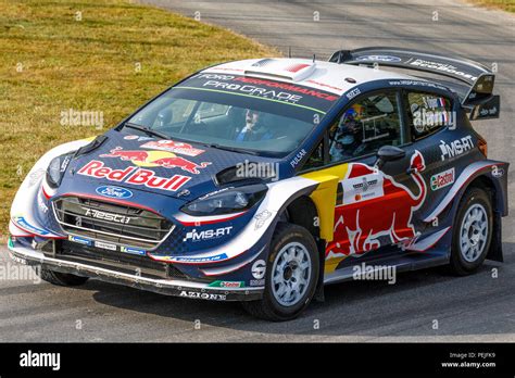 Ford Fiesta Wrc Rally Car With Driver Sebastien Ogier At The