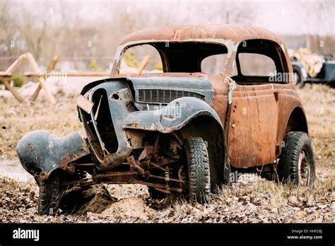 Old Broken Crashed Rusty Car Abandoned During The Second World War Is