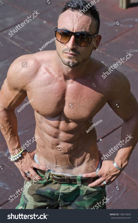 Стоковая фотография 148219649 Handsome Muscular Bodybuilder Seen Above