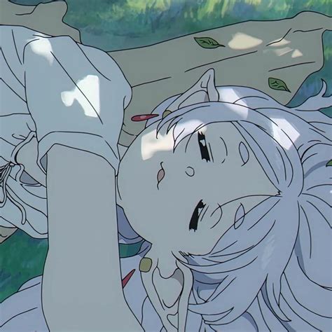 An Anime Character Laying On The Ground With Her Eyes Closed