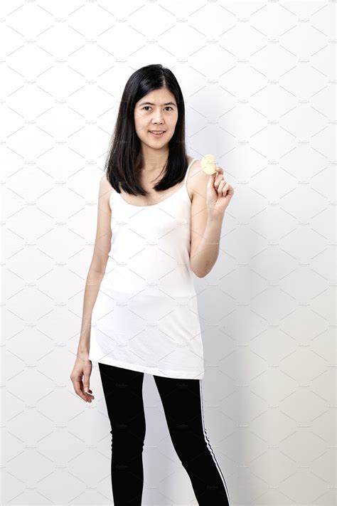 Woman Asian Holding A Potato Chips Featuring Asian 30 Years Old And Eating People Images