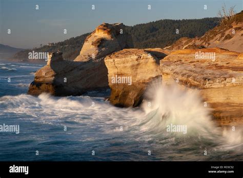 Wave Crashing On Sandstone Bluffs At Cape Kiwanda On The Central Oregon