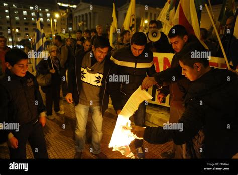 Kurdish Protesters Burn A Poster With The Picture Of The Turkish Prime