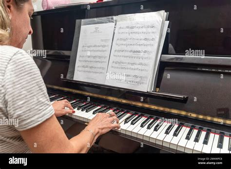 Beautiful Brazilian Pianist Woman Touching Piano Keys Playing Upright