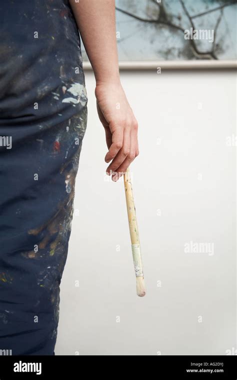 Woman Holding Paintbrush Back View Mid Section Stock Photo Alamy