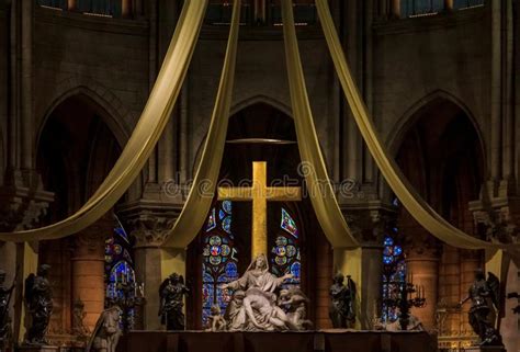 The Altar And The Cross Of The Notre Dame De Paris Cathedral With The