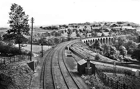 An Old Black And White Photo Of Train Tracks