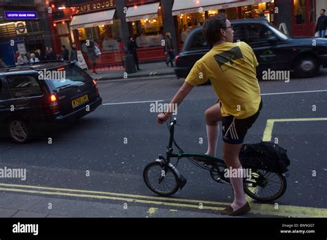 Shorts Wearing Cyclist Looks Over Shoulder Before Re Joining Traffric