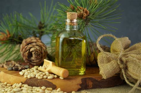 Cedar And Spruce Essential Oil In Glass Bottle With Pine Nuts Cones