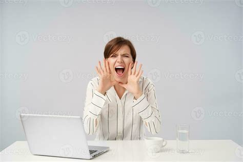 Excited Young Attractive Short Haired Brunette Lady Raising Hands To