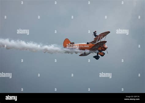 Breitling Boeing Stearman Wingwalker Biplane With White Smoke Trails