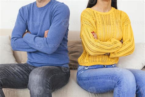 Youcouple Sitting Back To Back After A Fight On The Sofa Young Couple