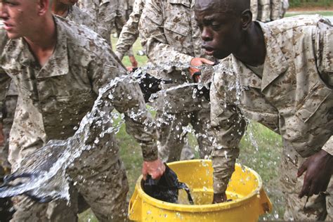 Marine Recruits Dip Their Gas Masks After The Gas Chamber Confidence