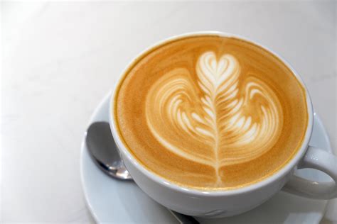 Coffee latte art in coffee shop 11041875 Stock Photo at Vecteezy