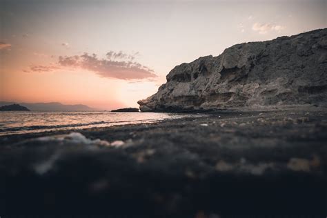 Sunset over Rocky Coastline · Free Stock Photo