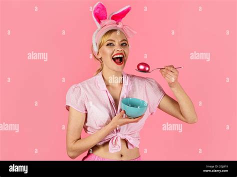 Easter Celebration Woman With Colored Egg Smiling Girl In Bunny Ears