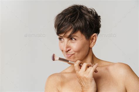 Mature Half Naked Woman Smiling While Posing With Powder Brush Stock