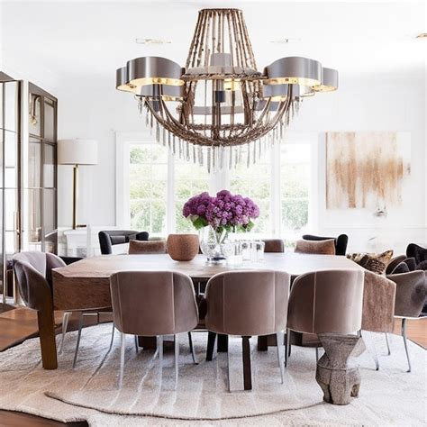 Premium AI Image A Stylish Dining Room With A Large Wooden Table