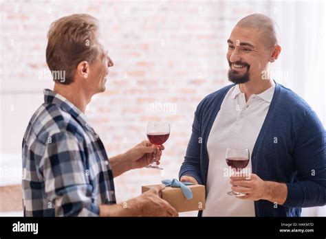 Positive Gay Couple Drinking Wine At Home Stock Photo Alamy