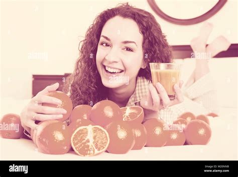 Portrait Of Brunette With Sweet Oranges And Juice In Tray Stock Photo Alamy