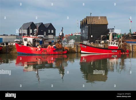 Whitstable Harbor Kent Fishing Boats Tied Up At The Wharf And