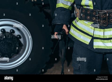 Partial View Of Firefighter With Portable Radio Set At Fire Station