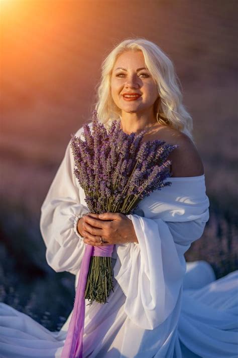 Blonde Woman Poses In Lavender Field At Sunset Happy Woman In White