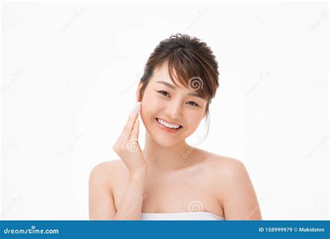 Beauty Portrait Of A Happy Half Naked Asian Woman Removing Make Up With A Cotton Pad Stock Image
