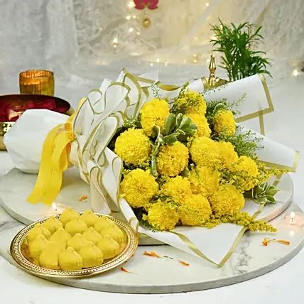 Online Marigold Flowers Bouquet with Modak Gift Delivery in UAE - FNP