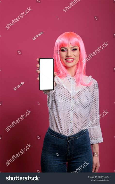 Smiling Person Pink Hair Showing Smartphone Stock Photo 2198951547